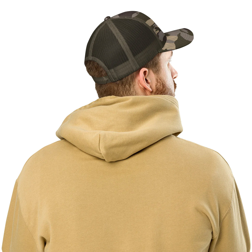 Back view of olive camo trucker hat with mesh panel worn with beige hoodie