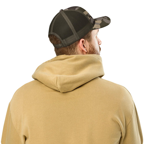 Back view of olive camo trucker hat with mesh panel worn with beige hoodie